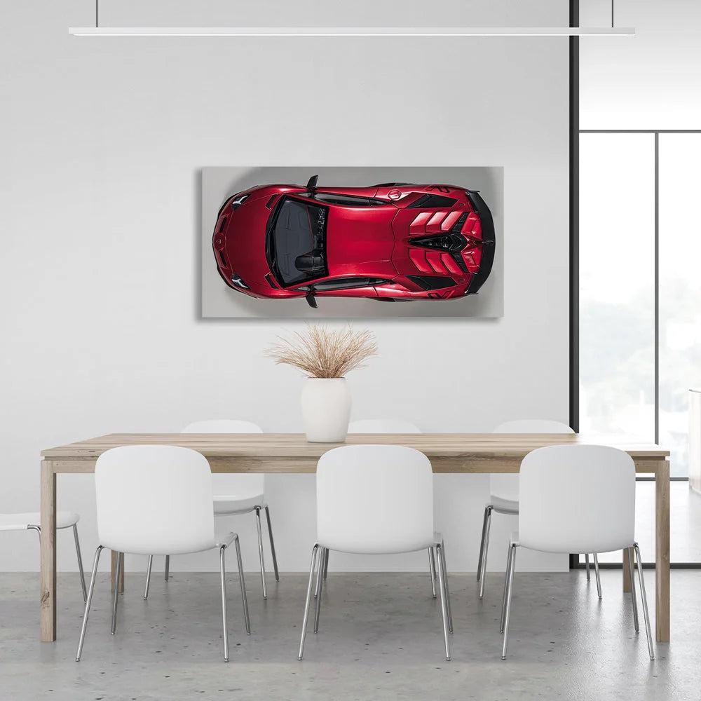 Das Auto ist ein kirschroter Lamborghini-Kunstdruck auf Leinwand.