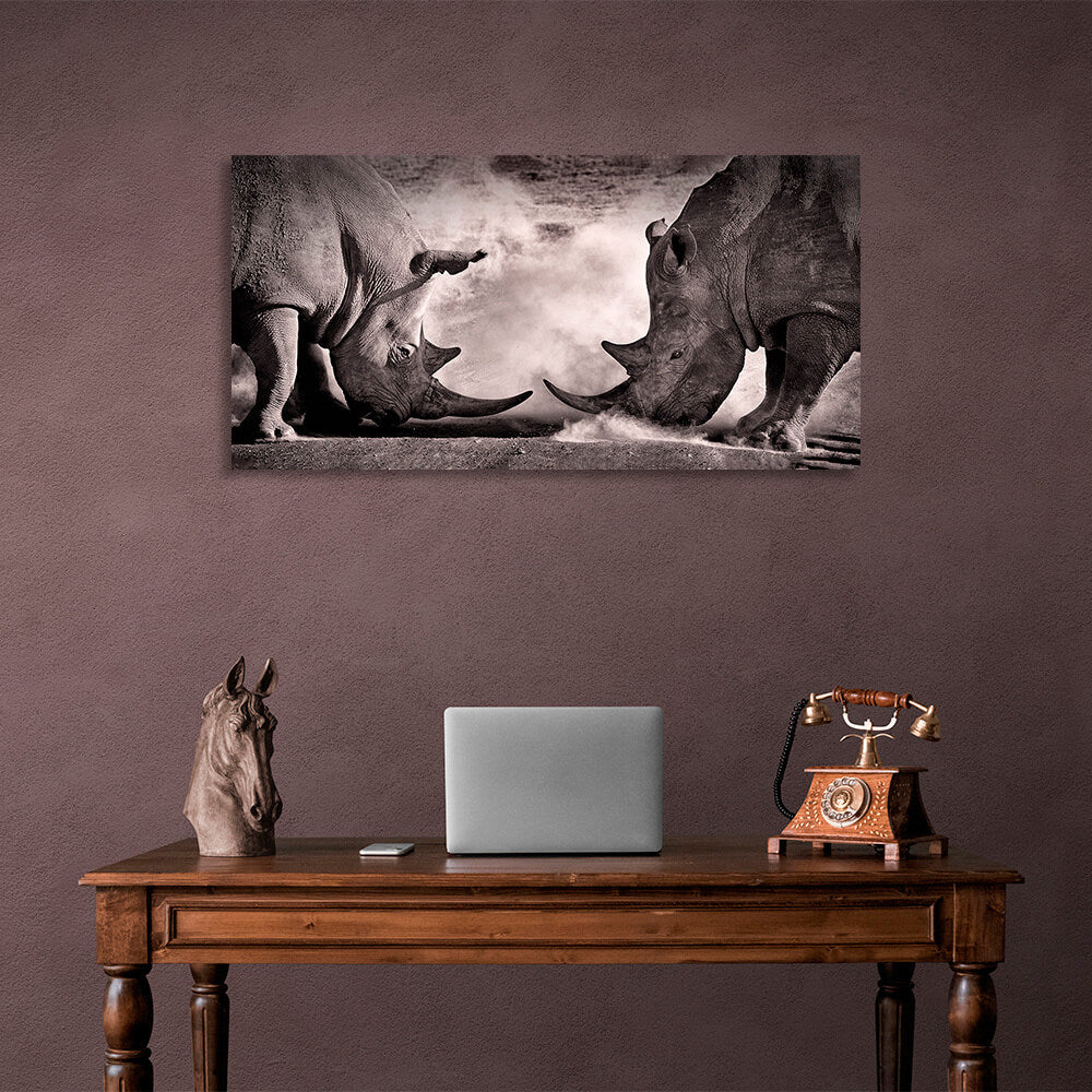 Two rhinos against the sand Canvas Wall Art Print