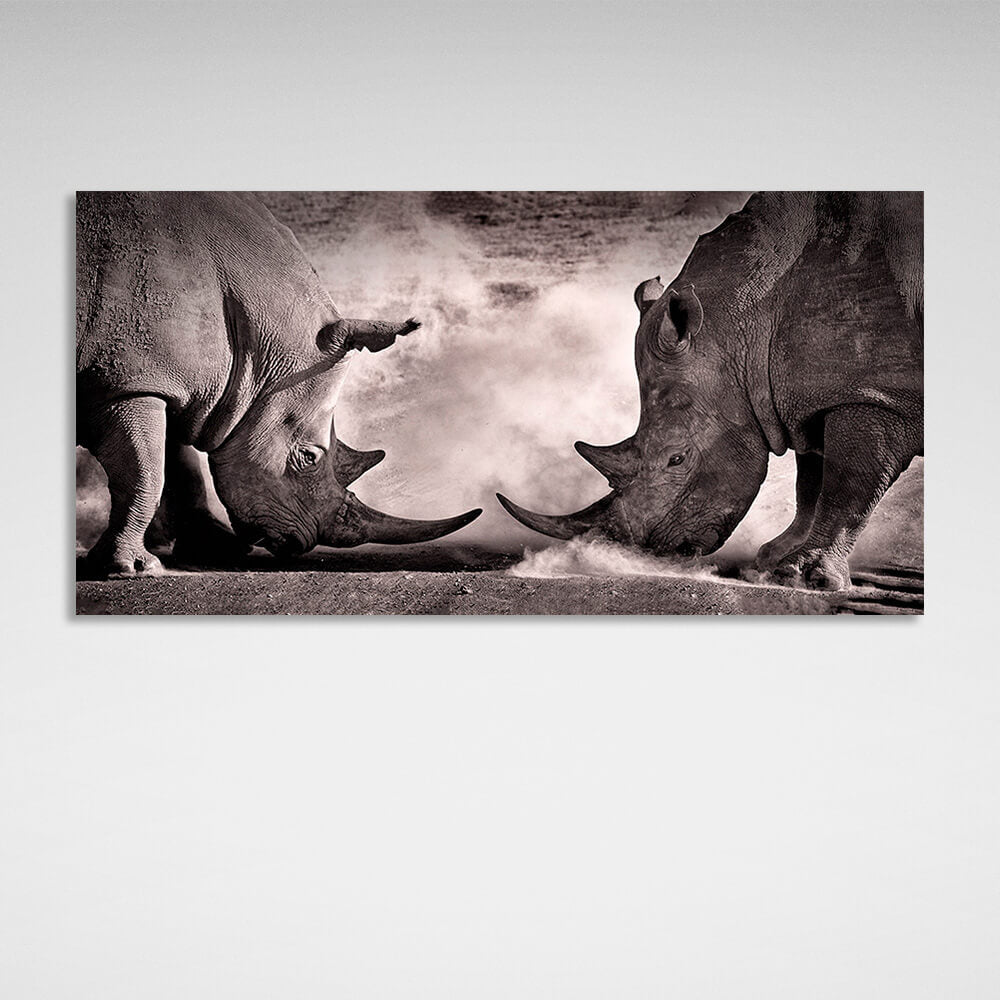 Two rhinos against the sand Canvas Wall Art Print