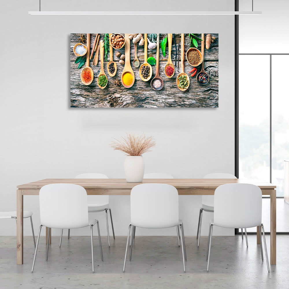 10 spoonfuls of spices on a wooden table with ginger garlic walnuts and pepper Canvas Wall Art Print For Kitchen