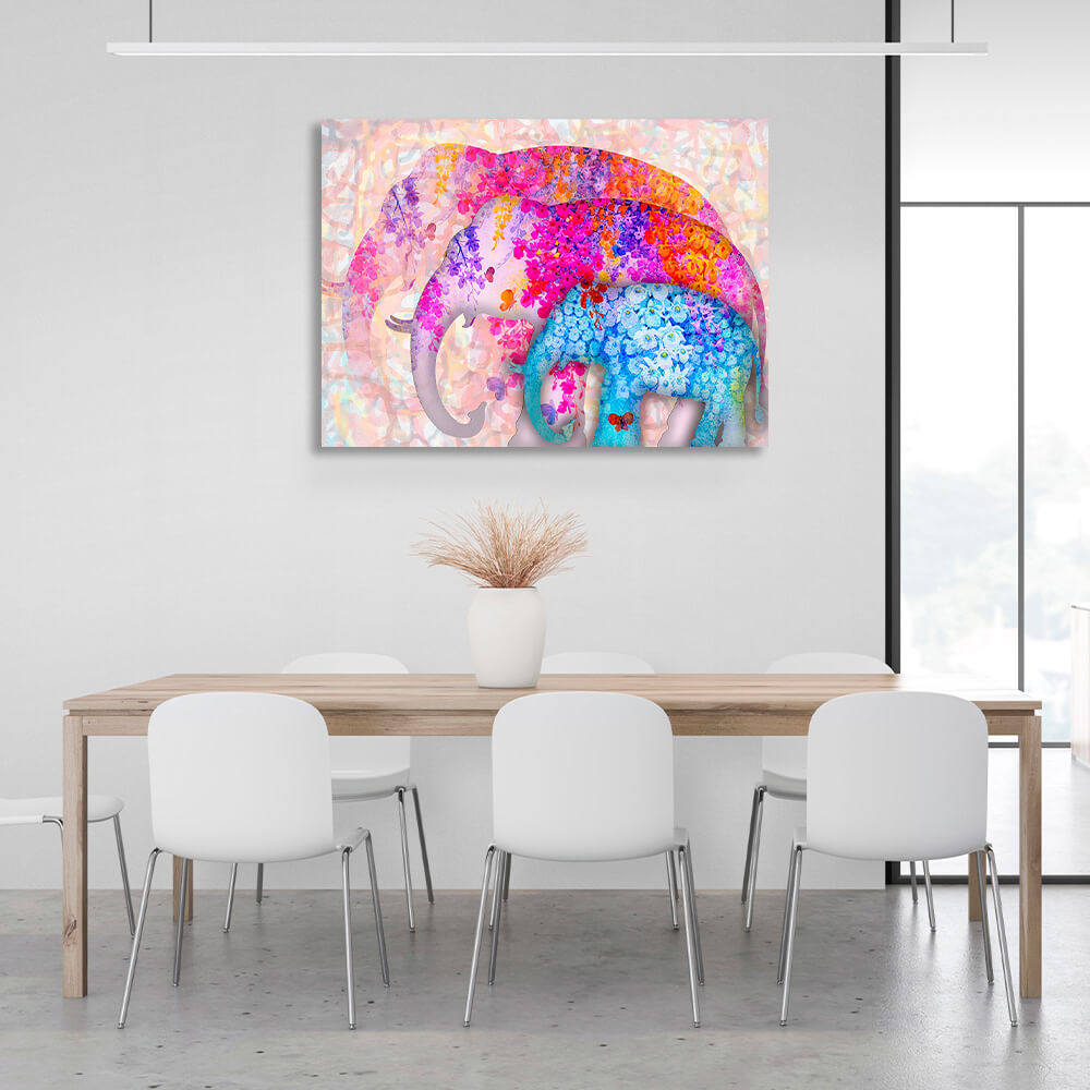 Three elephants of different sizes two of them are drawn in pink colors one in blue colors Canvas Wall Art Print