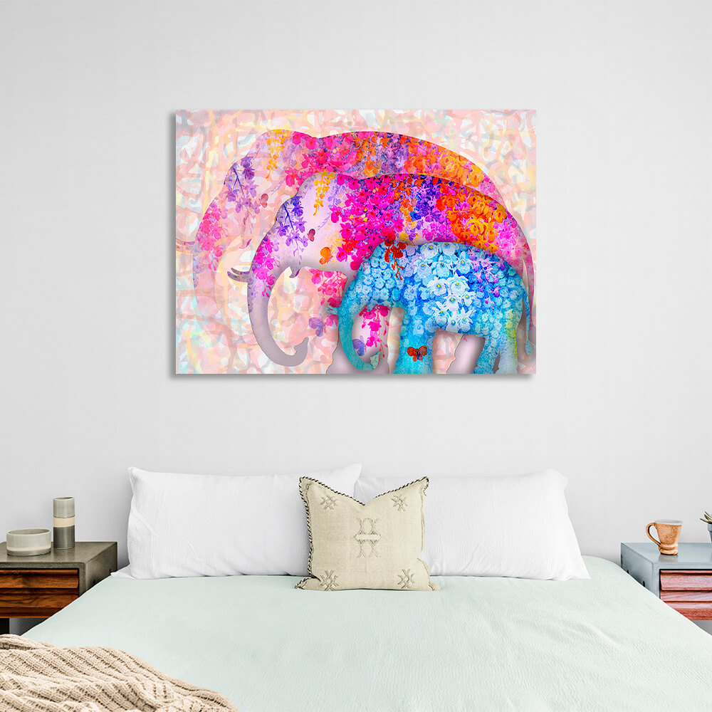 Three elephants of different sizes two of them are drawn in pink colors one in blue colors Canvas Wall Art Print