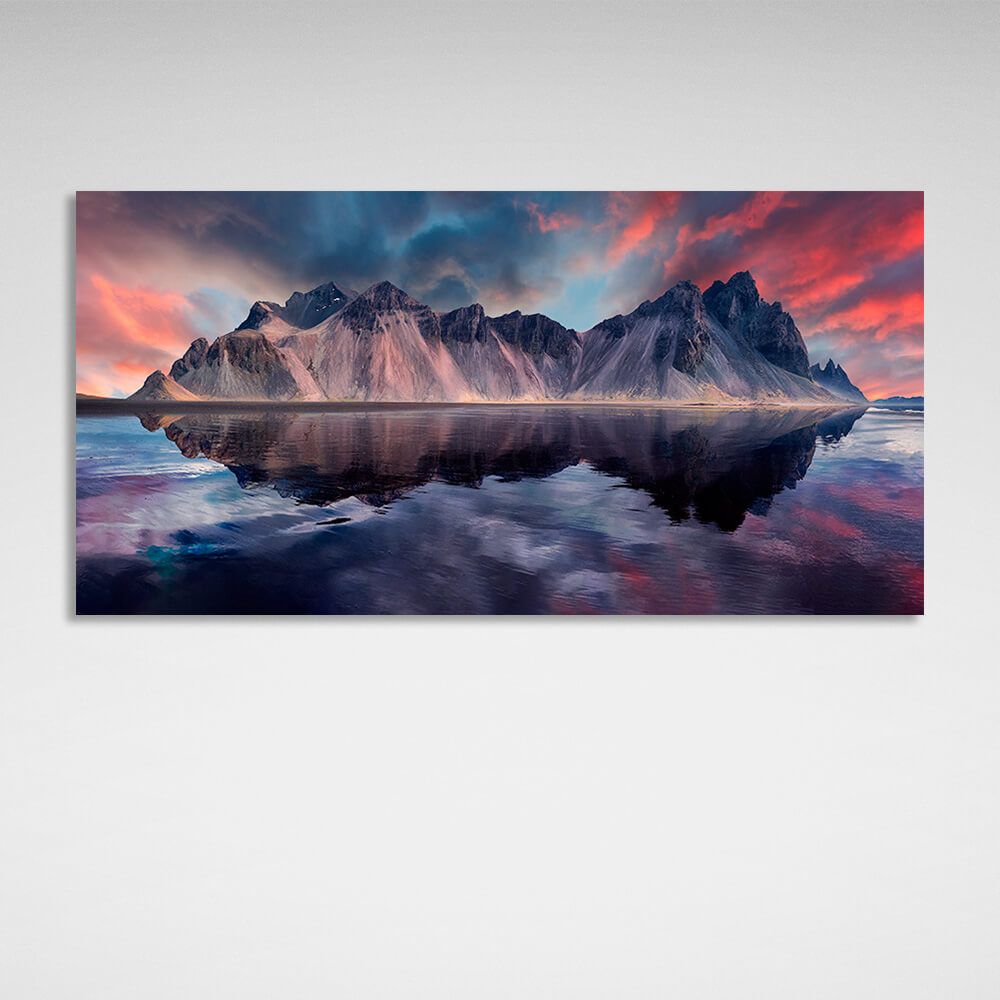 Kunstdruck auf Leinwand „Ein Felsen im Meer vor einem rot-blauen Himmel“