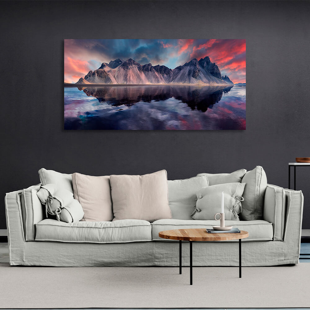 Kunstdruck auf Leinwand „Ein Felsen im Meer vor einem rot-blauen Himmel“