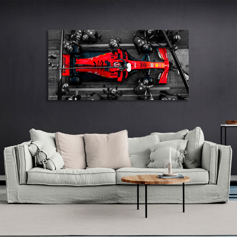 Formula 1 car with people in black suits Canvas Wall Art Print