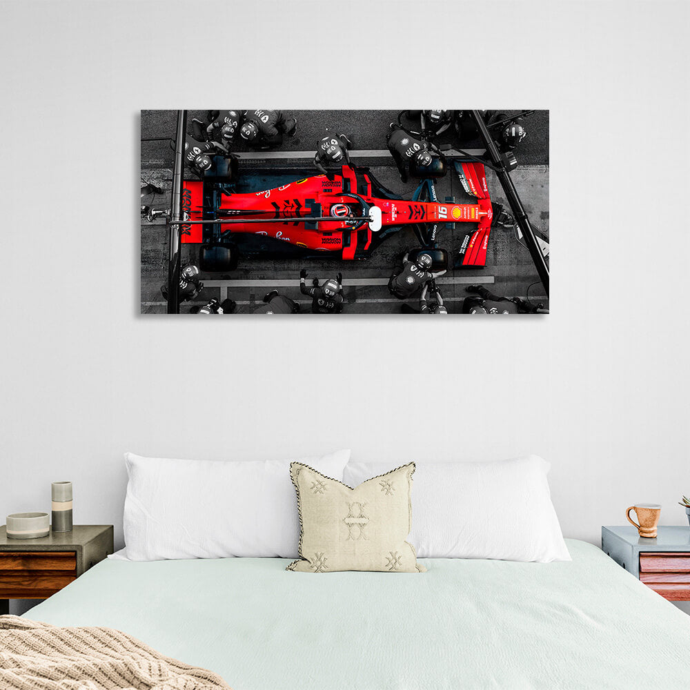 Formula 1 car with people in black suits Canvas Wall Art Print