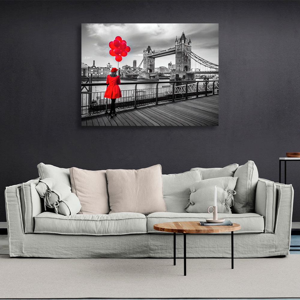 A woman in a red coat and red balloons in the background of London Bridge Canvas Wall Art Print