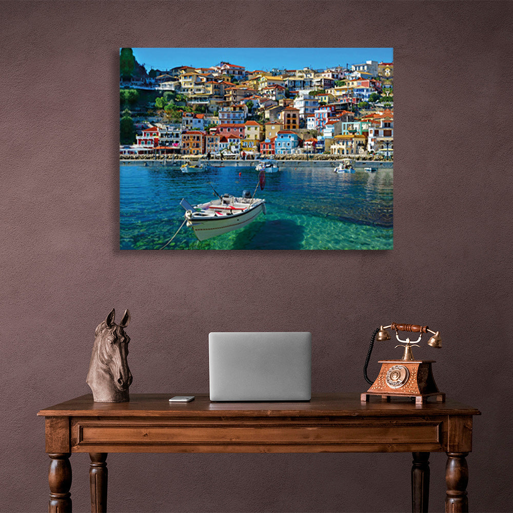 A boat in an incredibly clear sea against the backdrop of a brightly colored city Canvas Wall Art Print