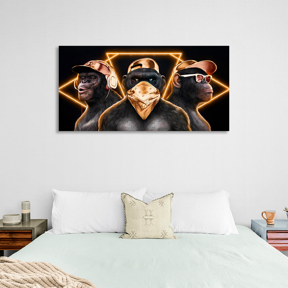 Three monkeys with gold accessories on a black background Canvas Wall Art Print